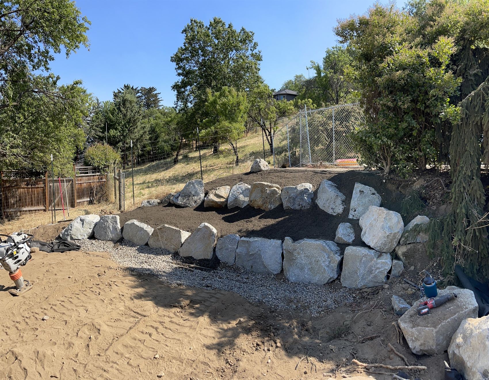 Boulder and rock feature with gravel and soil work in Southern Oregon