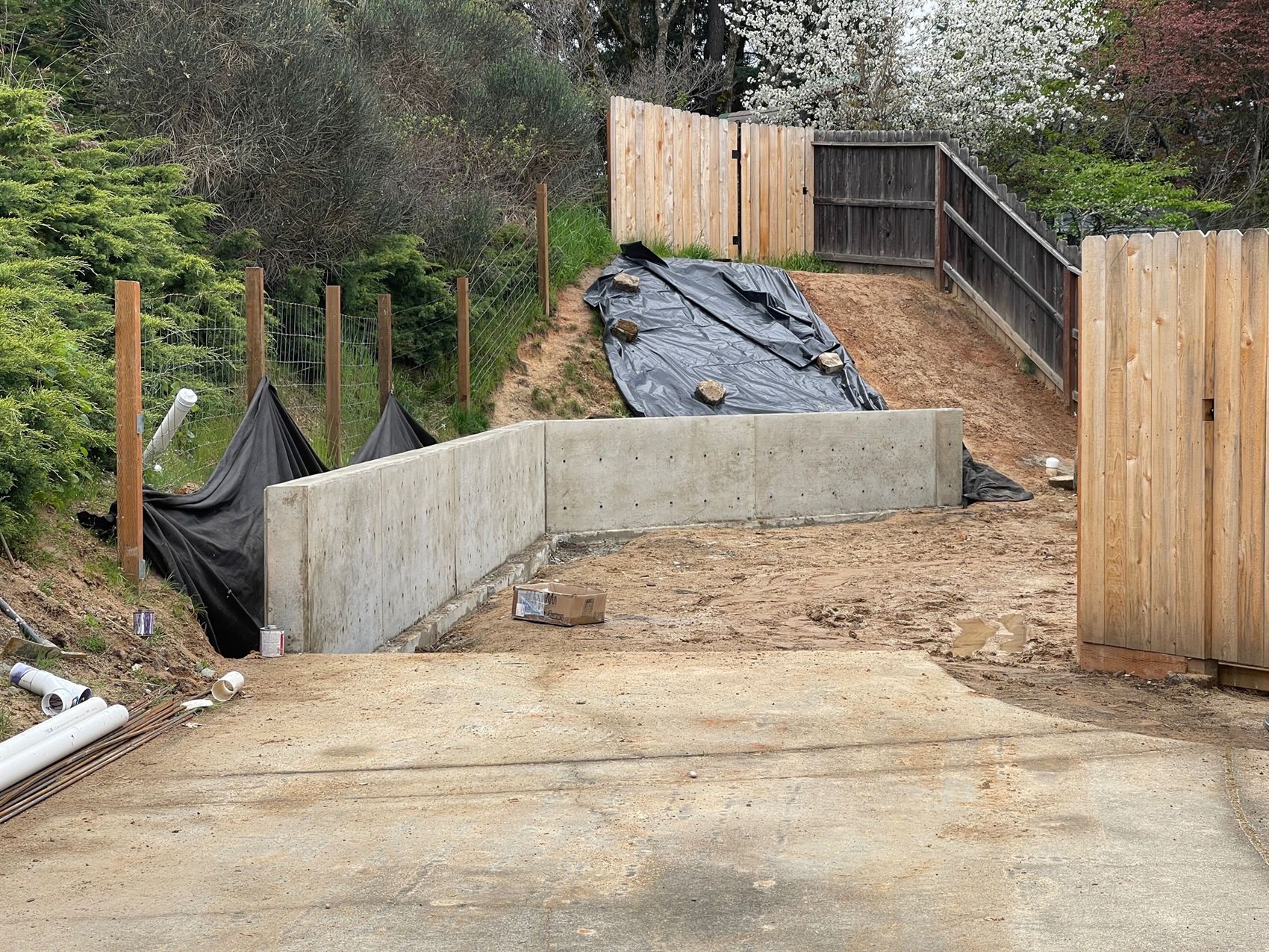 Poured concrete wall structure built into a slope in Southern Oregon