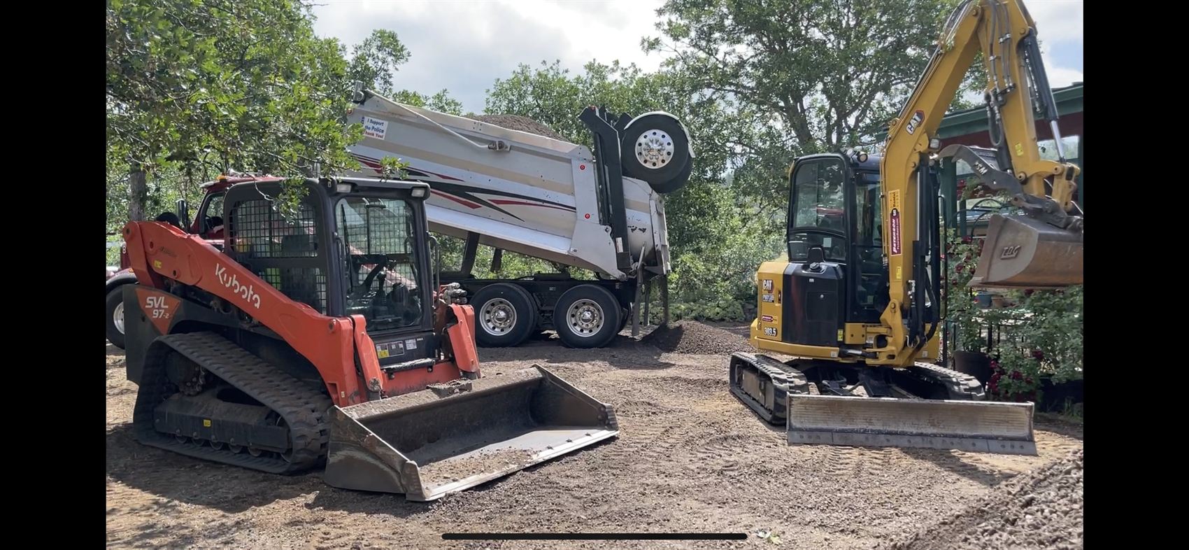 Pacific Earthworks skid steer, dump truck and CAT excavator creating defensible space for wildfire fuel reduction at an Eagle Point, Oregon jobsite