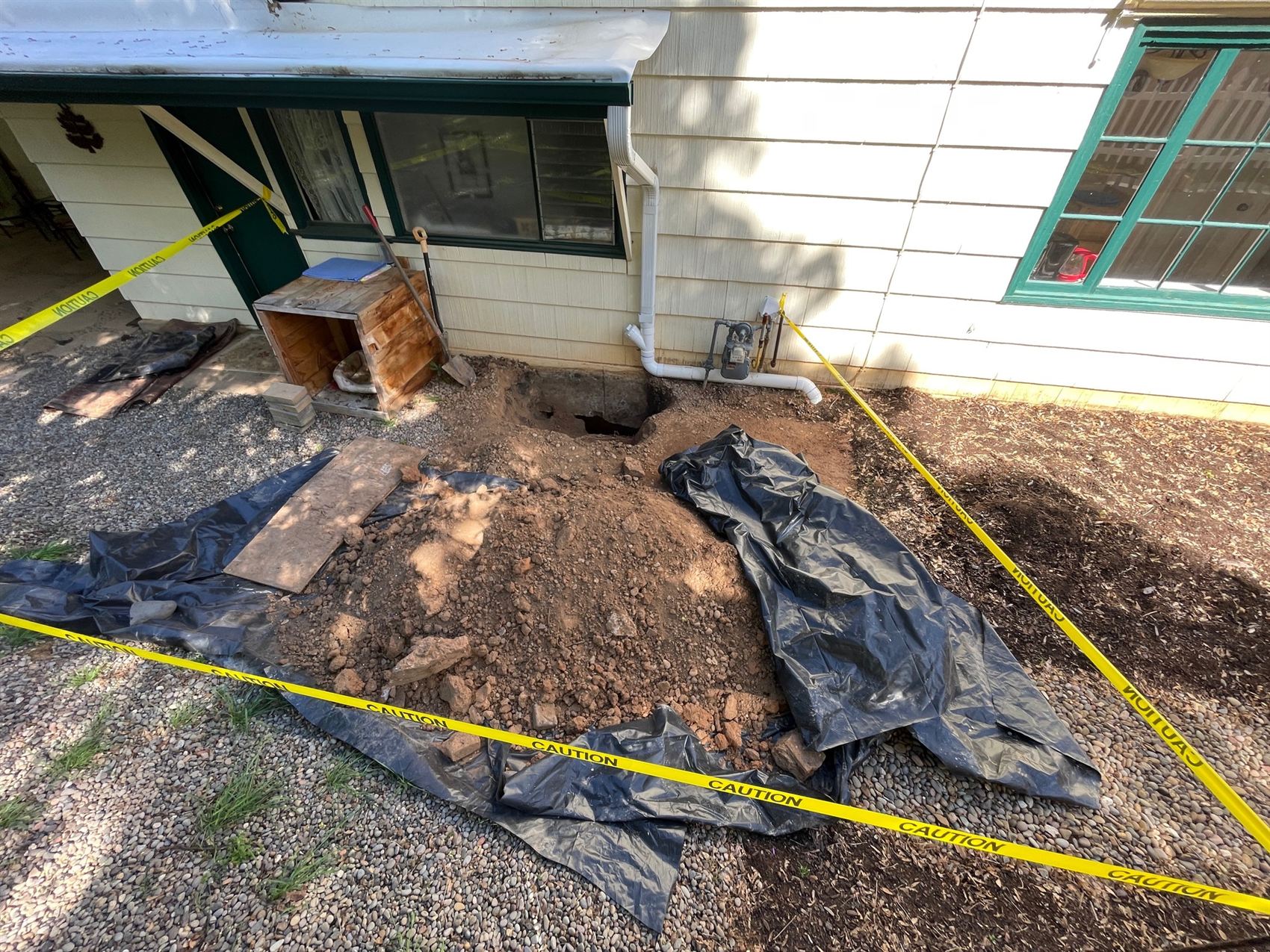 Deep excavation for a septic system installation alongside a Southern Oregon property