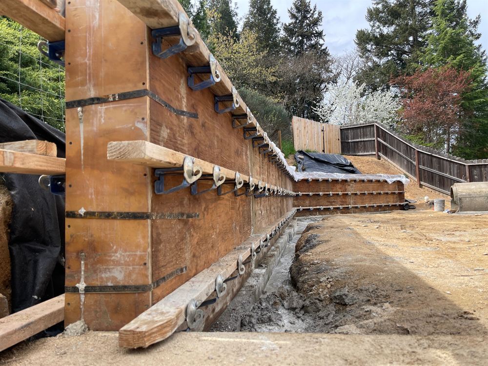 Plywood forms set for a poured concrete structure on a sloped lot