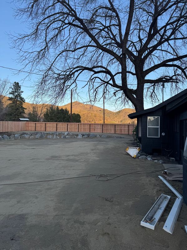 Finished, graded commercial parking and event area with a rock border in Jacksonville, Oregon