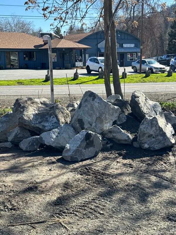 Large landscape boulders delivered roadside for retaining and border work in Jacksonville, Oregon